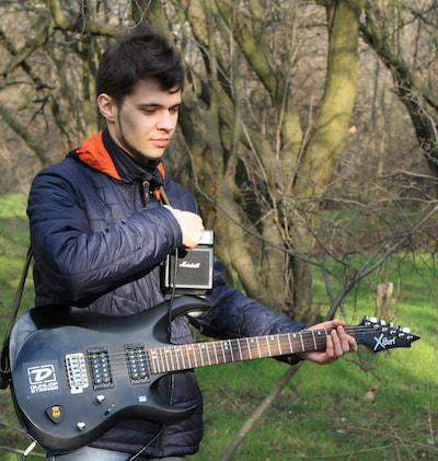 Anatolii Ovcharuk with guitar.